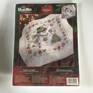 Plaid Bucilla stamped cross stitch snowman lap quilt for embroidery.